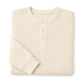 Man wearing ivory waffle knit henley with dark denim