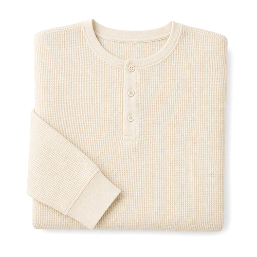 Man wearing ivory waffle knit henley with dark denim