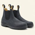Man wearing blue leather Chelsea boots with slim dark denim