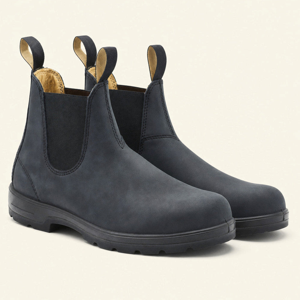 Man wearing blue leather Chelsea boots with slim dark denim