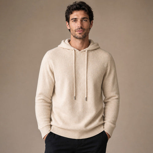 Beige wool knit hooded pullover shown flat with ribbed cuffs and hem