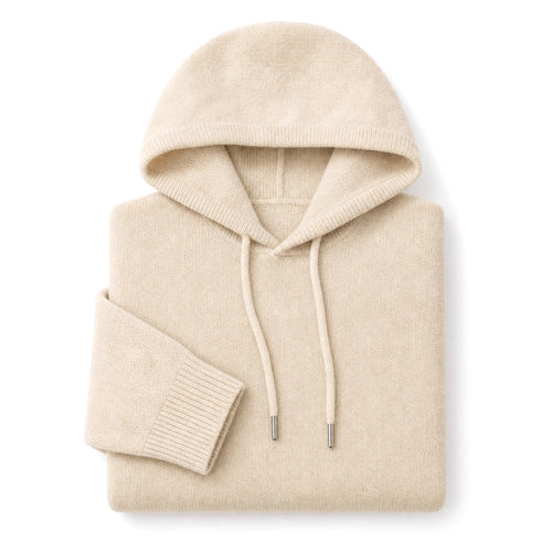 Man wearing beige wool knit hoodie over a shirt with dark trousers
