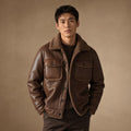 Brown vegan leather jacket with full fleece lining, front zip closed