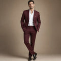 Man wearing burgundy notch-lapel suit with white shirt