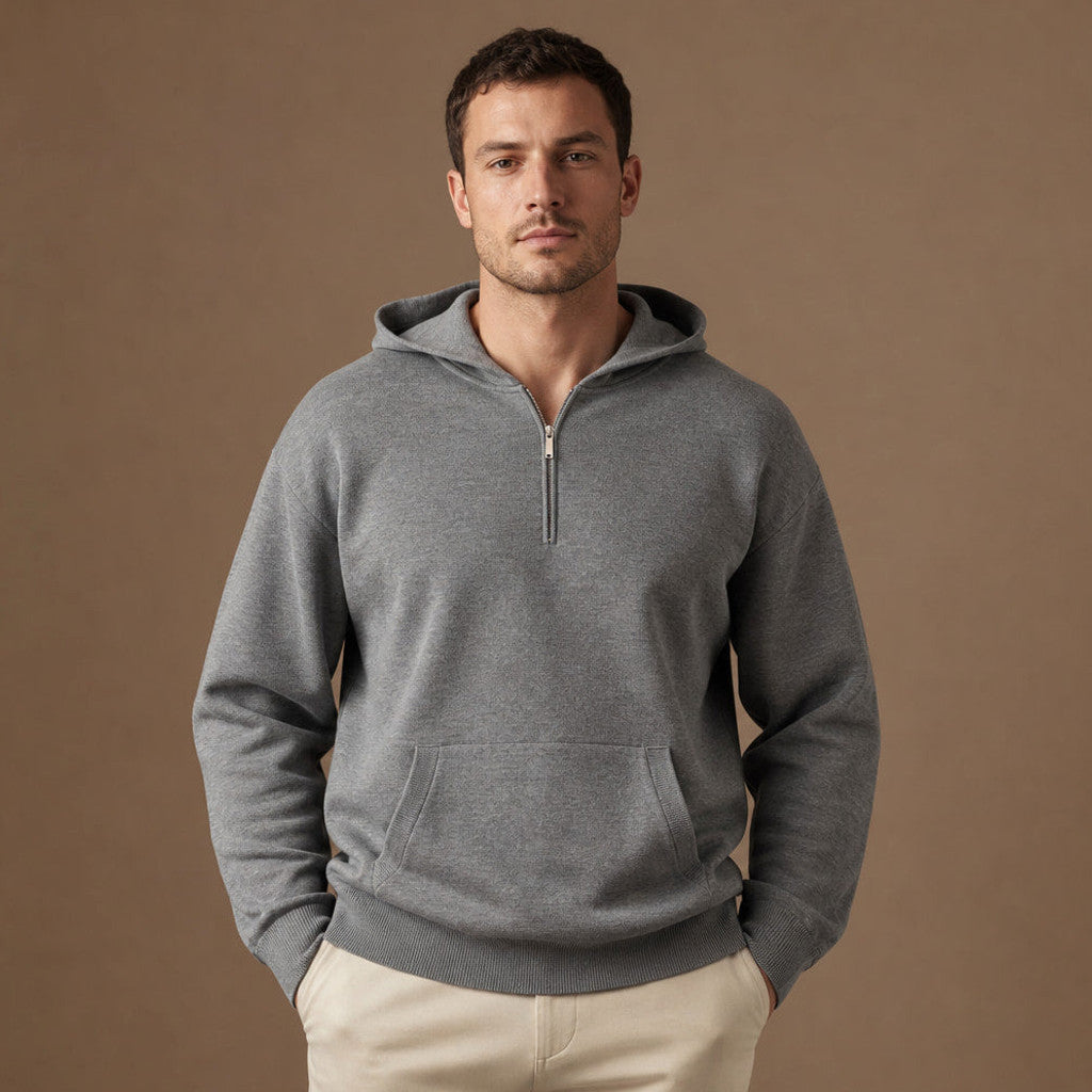 Dark grey half-zip knit hoodie with ribbed collar, shown flat