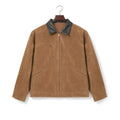 Man wearing brown moleskin zip coat over a knit with dark denim