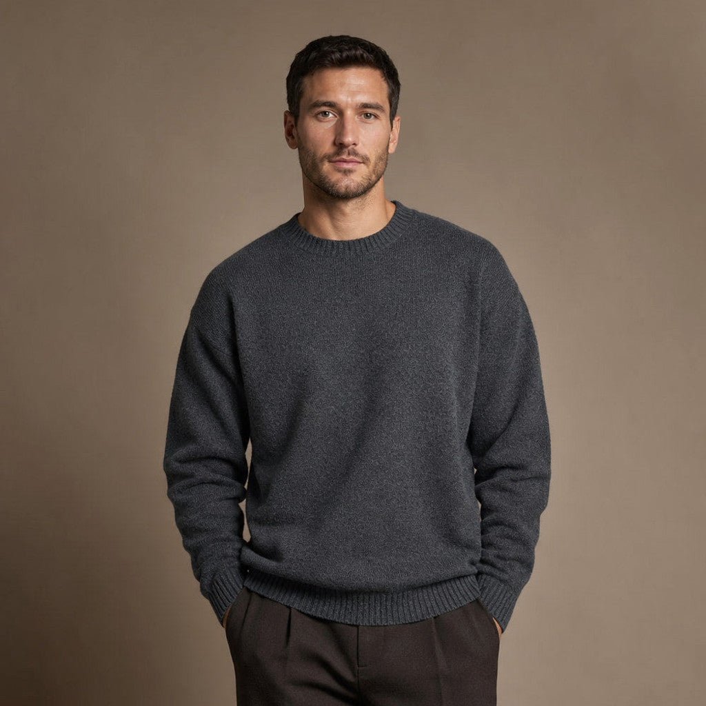 Dark grey chunky ribbed wool jumper with crew neck, shown flat