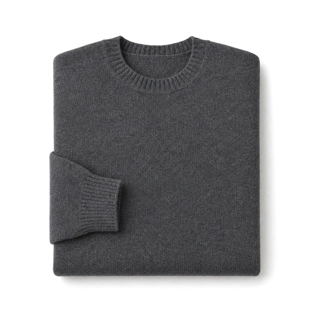 Man wearing dark grey ribbed wool jumper with dark denim