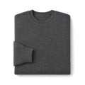Man wearing dark grey ribbed wool jumper with dark denim