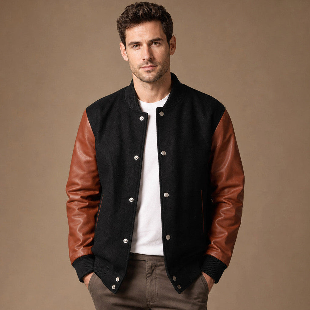 Varsity jacket with black wool body and sienna brown leather sleeves, front view