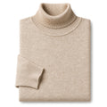 Man wearing khaki turtleneck sweater under an open overcoat
