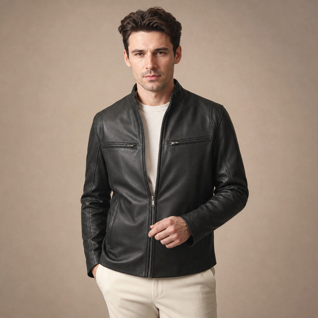Man wearing a black sheepskin cafe racer jacket over a knit with dark denim
