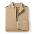 Man wearing light khaki quarter zip waffle jumper with dark trousers