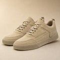 Taupe low-top trainer with textured upper and cushioned midsole