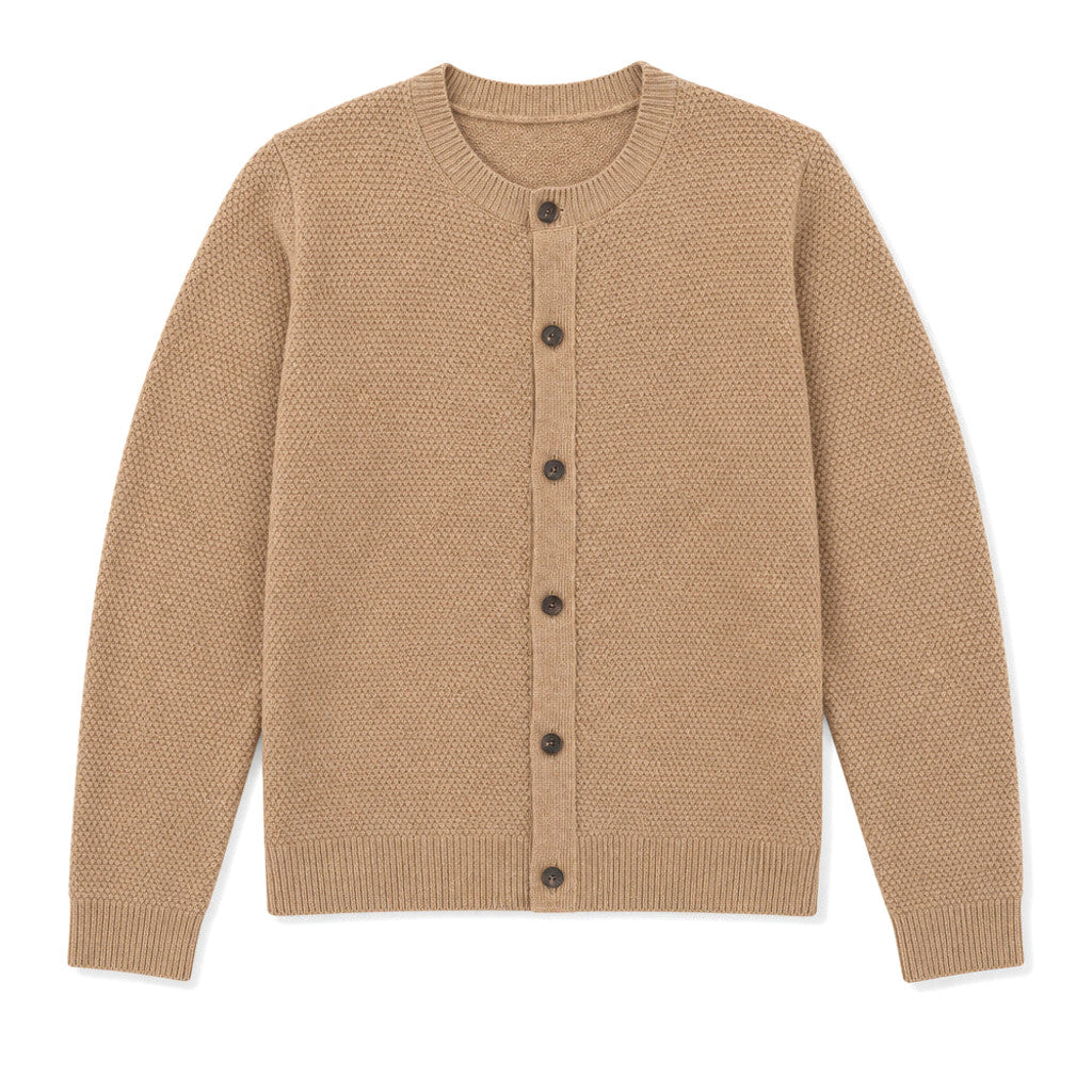 Man wearing camel seed-stitch wool cardigan over a collared shirt