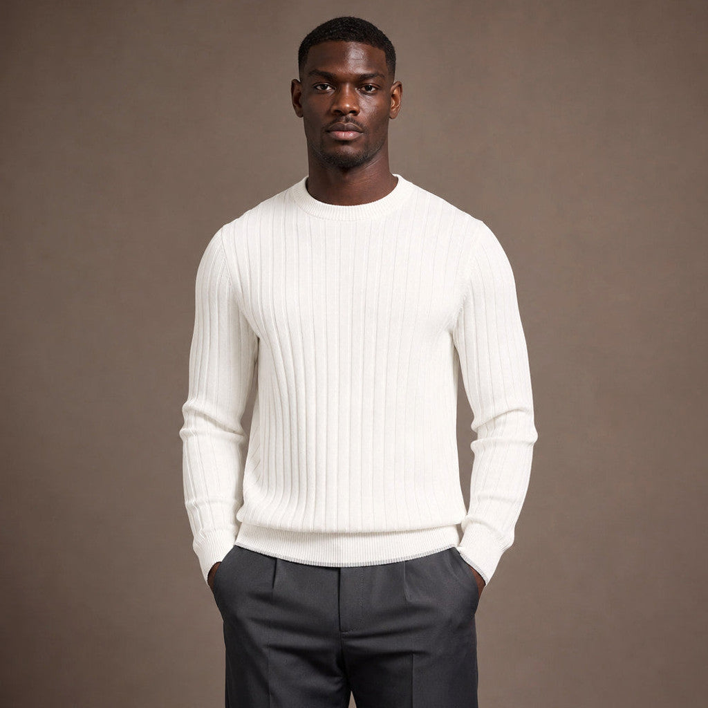 Man wearing ivory ribbed crewneck jumper with tailored trousers