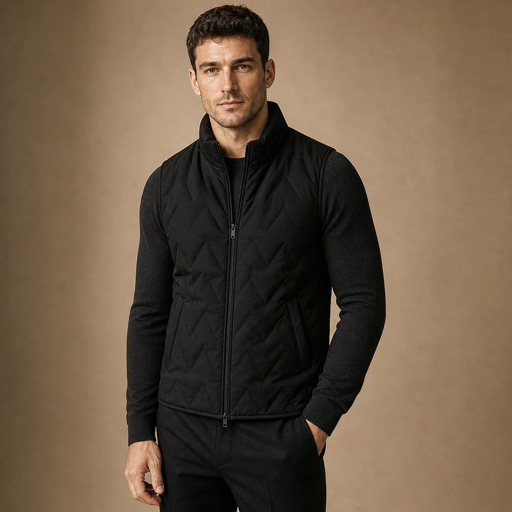 Man wearing black sherpa waistcoat over a crewneck with dark denim