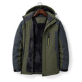Man wearing green padded windbreaker coat with hood attached