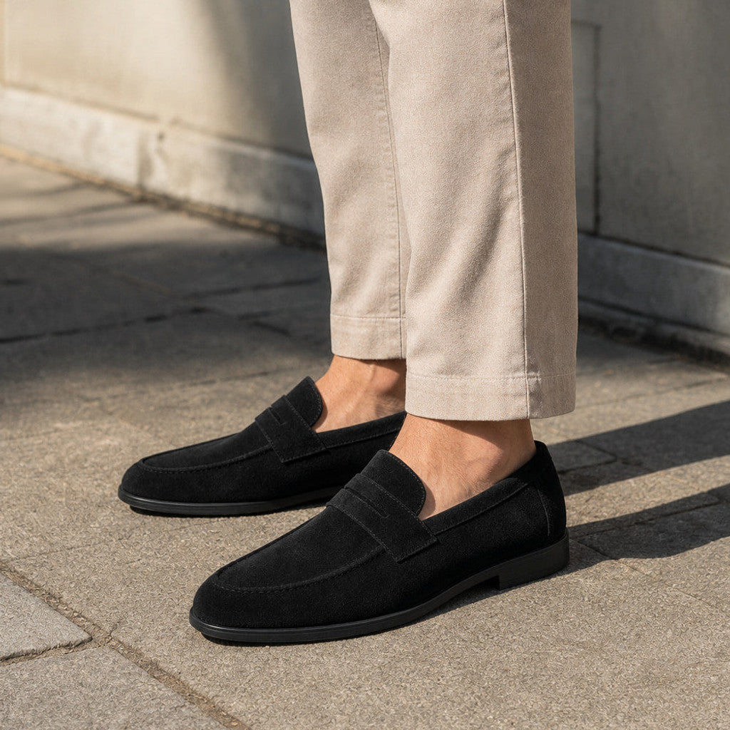 Man wearing black suede loafers with cropped chinos