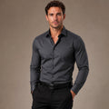 Man wearing a Black Gray slim fit long sleeve dress shirt with trousers