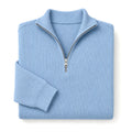 Man wearing blue open front cardigan over a white tee with dark denim