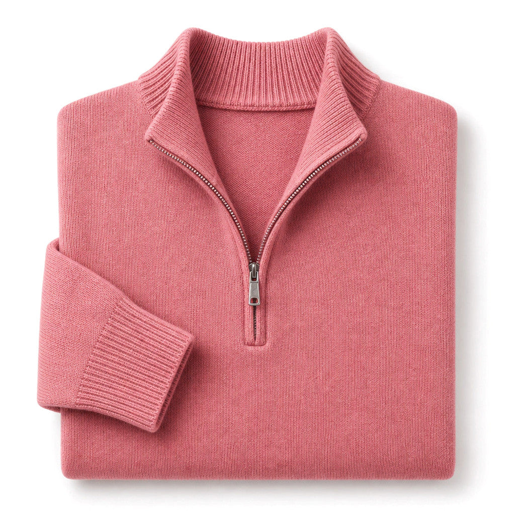 Man wearing pink ribbed quarter zip jumper with dark trousers