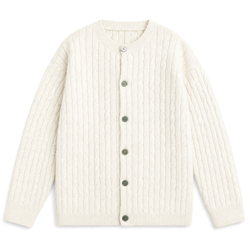 Man wearing ivory cable knit cardigan over a shirt