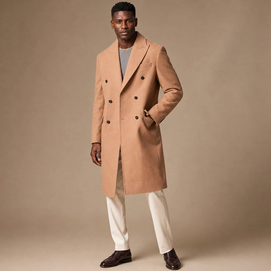 Man wearing tan knee-length double-breasted wool overcoat over a dark suit