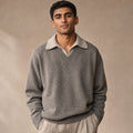 Man wearing taupe mock collar V-neck jumper with dark trousers