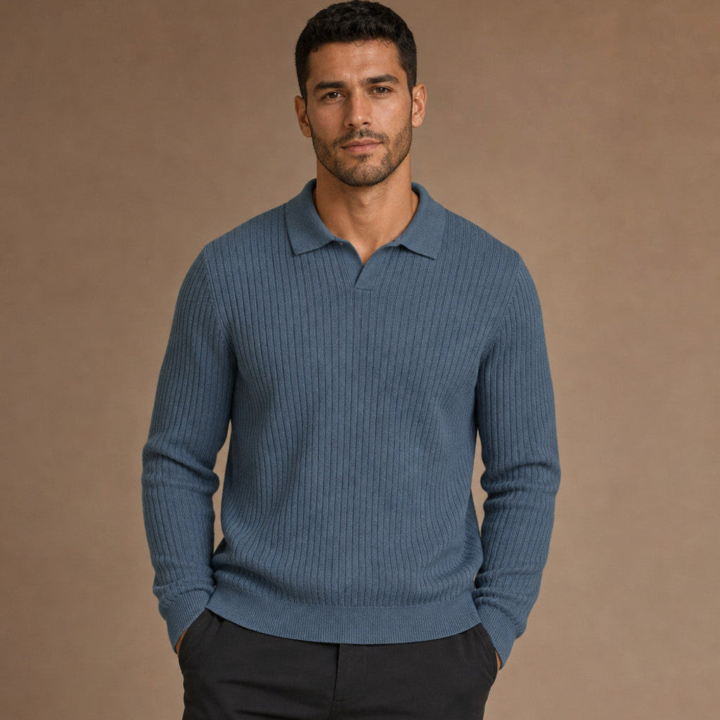 Man wearing glacier blue ribbed knit polo with dark trousers