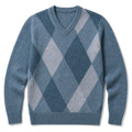 Man wearing blue plaid V-neck jumper over a shirt