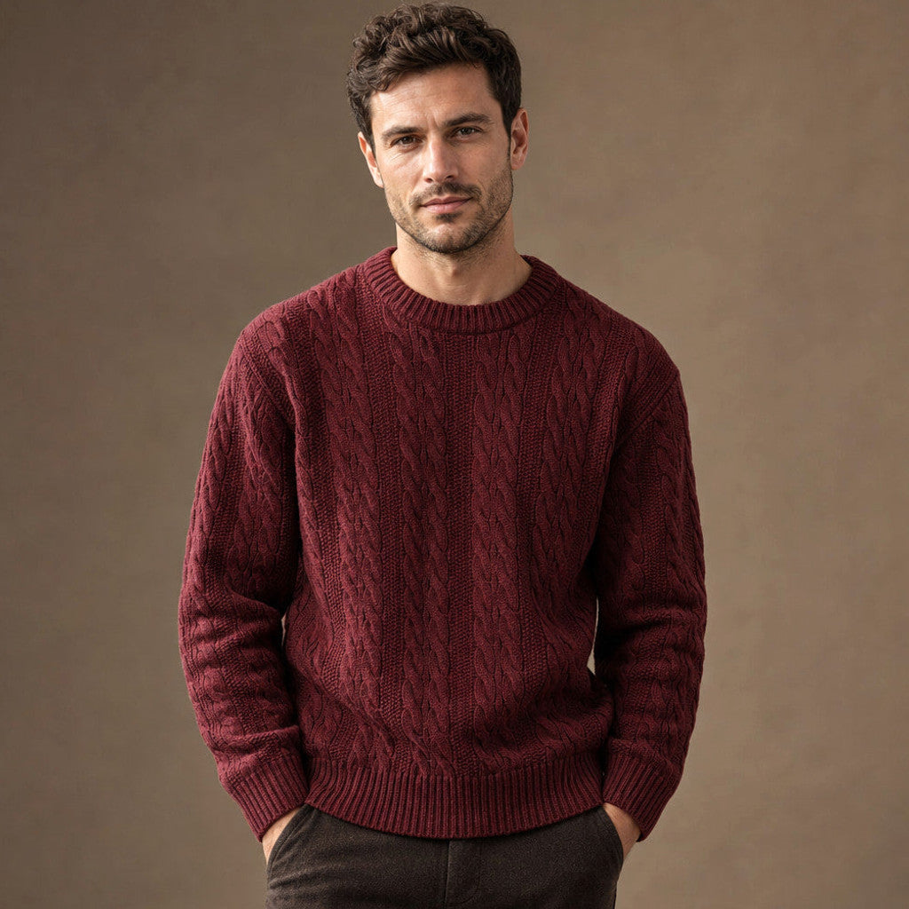 Man wearing maroon cable knit jumper over a tee with dark denim
