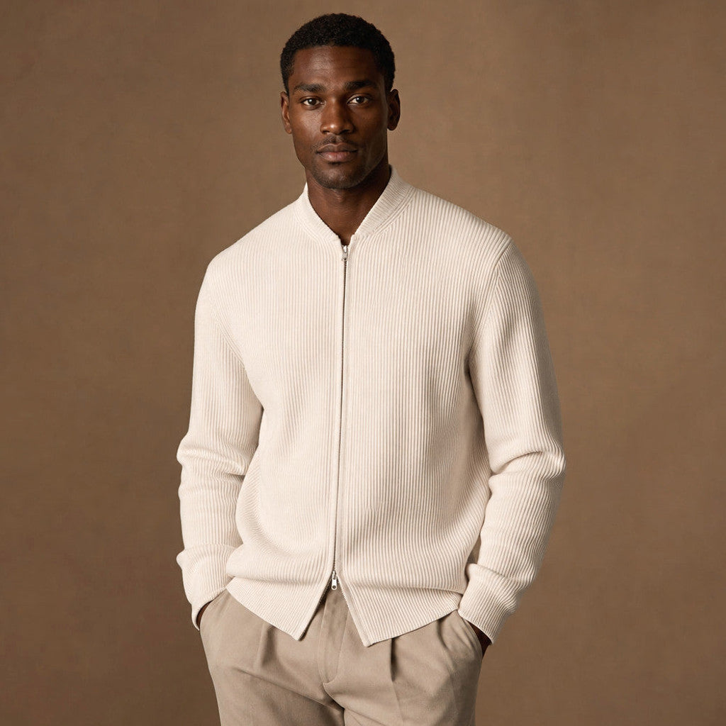 Man wearing ivory ribbed full-zip jacket with straight jeans