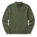 Man wearing green quarter zip jumper over a shirt