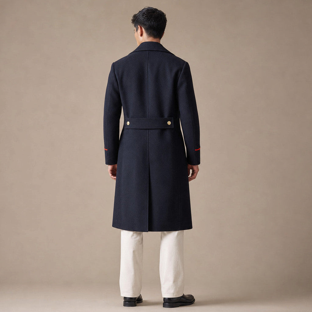 Man wearing navy double breasted longline coat over tailoring