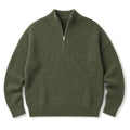 Man wearing green quarter zip jumper over a collared shirt