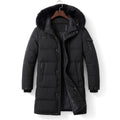 Man wearing longline down parka zipped to the chin in winter