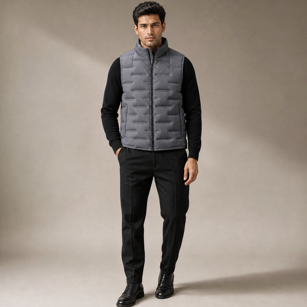 Man wearing gray sleeveless puffer vest over knitwear