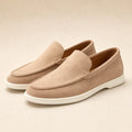 Beige suede-look slip-on driving loafer on a plain background