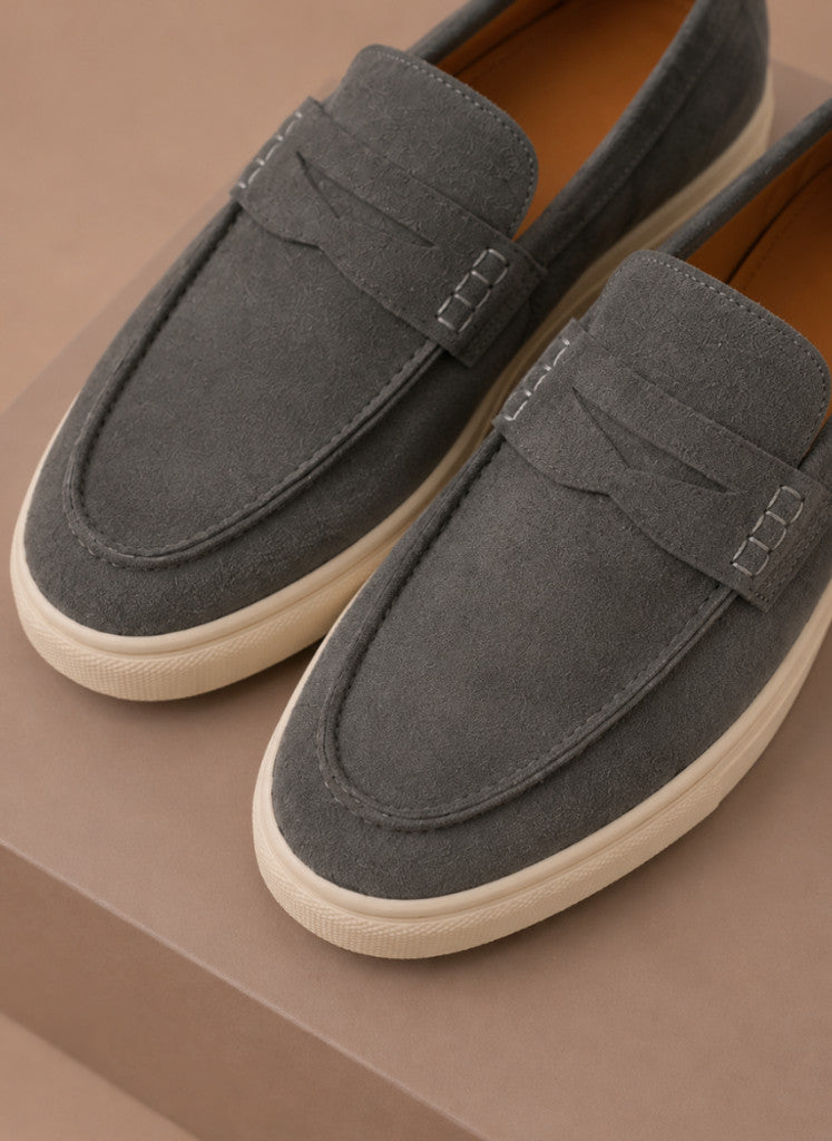 Model wearing suede penny loafers in brown – Tomosino