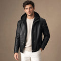 Man wearing black leather hooded jacket with detachable hood and zipped cuffs