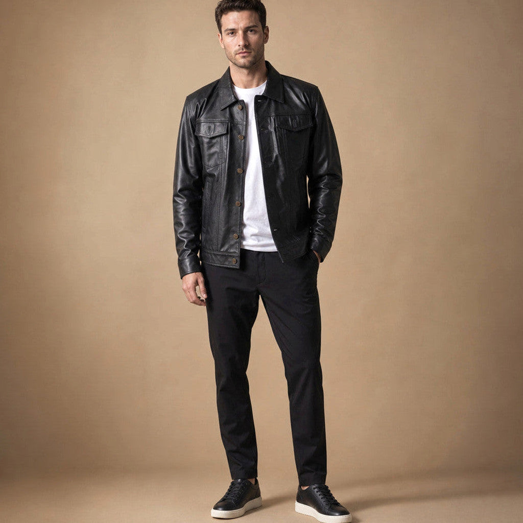 Man wearing a black sheepskin trucker jacket over a crew neck and dark denim