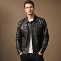 Black sheepskin leather trucker jacket with buttoned front and chest flap pockets