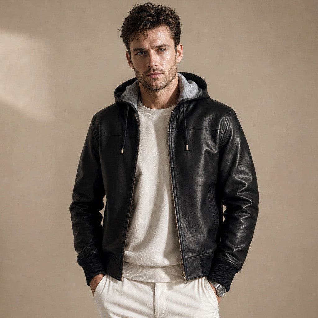 Man wearing a black hooded leather bomber jacket with the zip drawn up