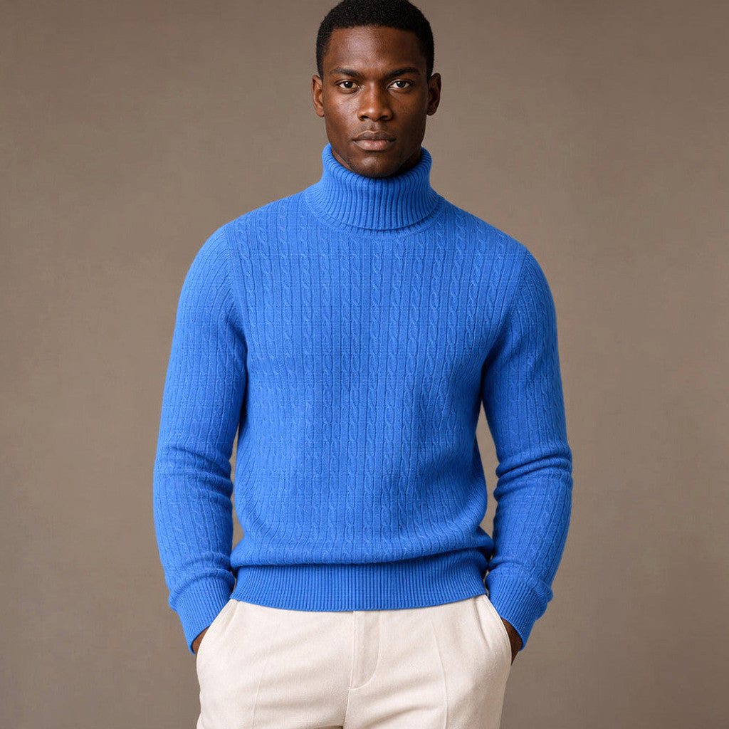 Blue cable knit turtleneck sweater with ribbed collar and cuffs
