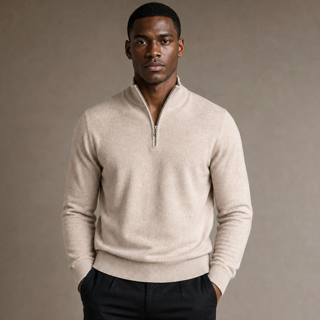 Beige quarter zip mock neck knit jumper on a plain background