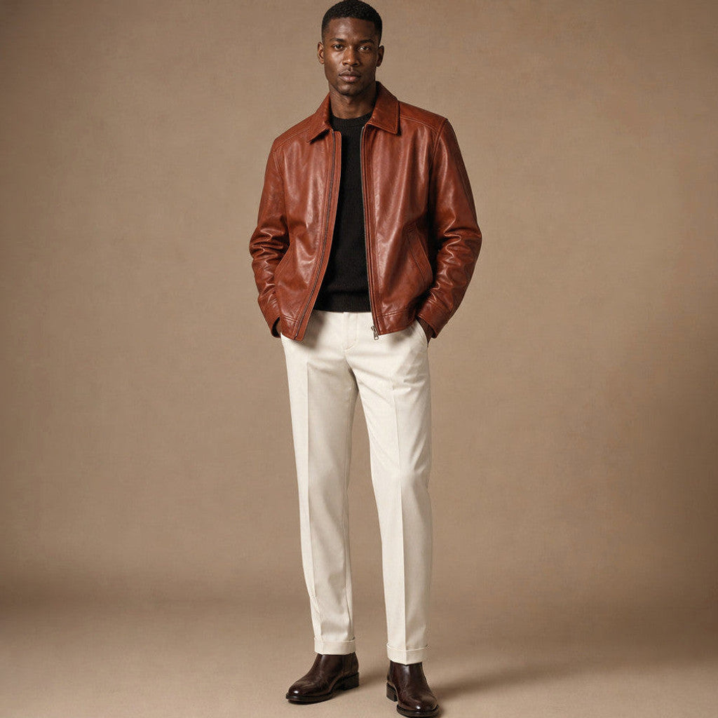 Man wearing reddish-brown sheepskin leather biker jacket with collar turned up