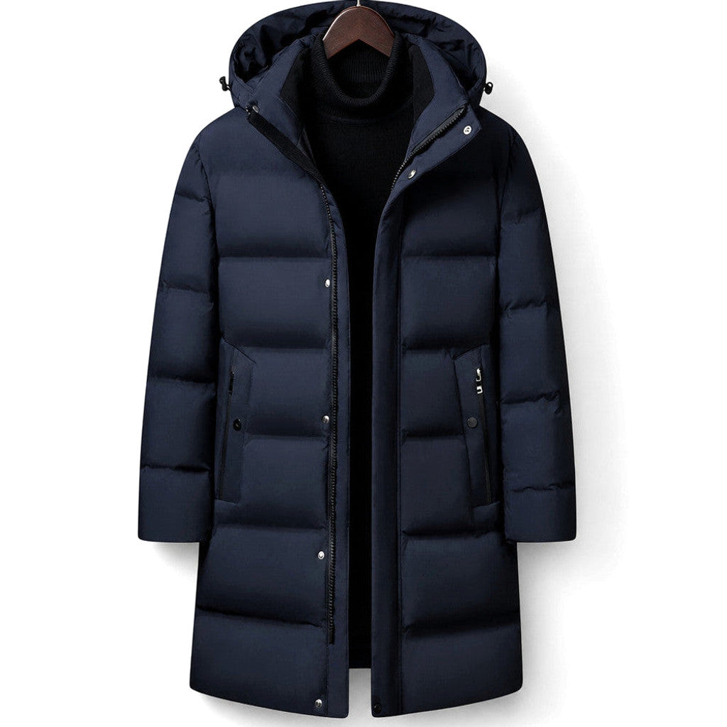 Man wearing dark blue hooded down parka with trousers