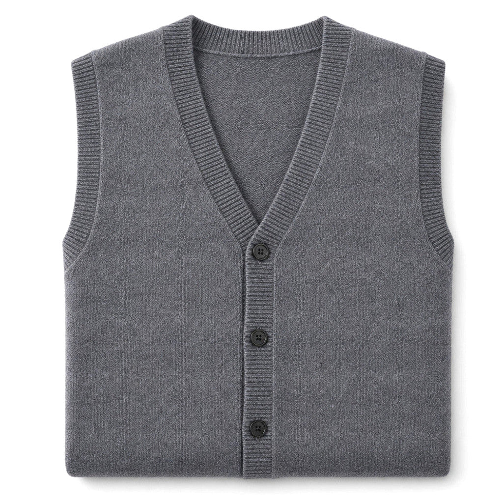 Man wearing grey knit sweater vest over a white shirt