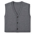 Man wearing grey knit sweater vest over a white shirt